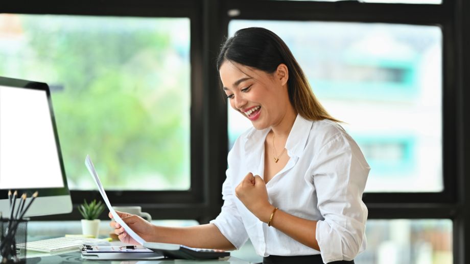 Smiling, successful small business owner.